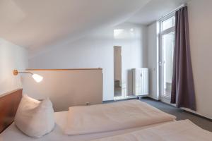 Un pat sau paturi într-o cameră la Schneeeule 220 +14 fotografii