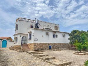 a large white building with stairs in front of it at Casa Ignatz 5 Bed Luxury Villa with Private Pool in Jávea