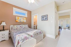a bedroom with a bed and a dresser and a window at The Lynx - 35 Butternut in Cherry Valley