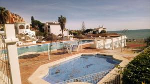 a view of a swimming pool at a villa at Mansión Alhamar Beachfront in Sitio de Calahonda