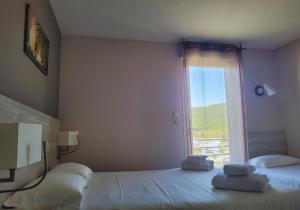 Postel nebo postele na pokoji v ubytování Hotel Restaurant Les Chataigniers