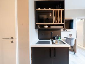 Kuchyň nebo kuchyňský kout v ubytování JustStay Mülheim Hotel & Apartments