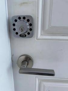 a door with a metal door knob and a doorhandle at 1-Bedroom - On site Parking - near YQR Airport in Regina
