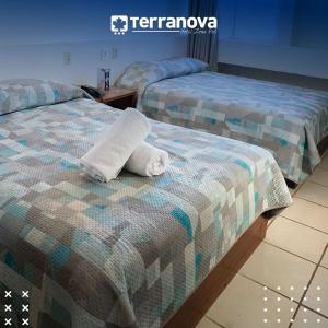Postel nebo postele na pokoji v ubytování Hotel Terranova