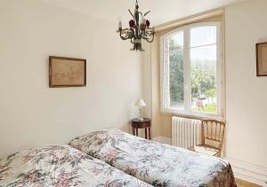 Un ou plusieurs lits dans un hébergement de l'établissement L'Auberge 91530