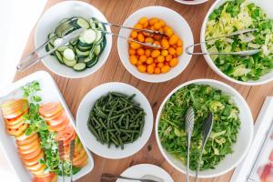a table topped with bowls of different types of vegetables at Miramare Sea Resort & Spa in Ischia