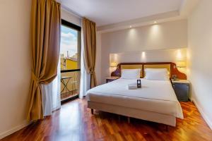 Postel nebo postele na pokoji v ubytování B&B Hotel Firenze Pitti Palace al Ponte Vecchio