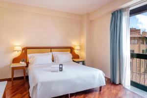 Postel nebo postele na pokoji v ubytování B&B Hotel Firenze Pitti Palace al Ponte Vecchio