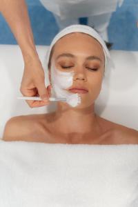a woman in a bathtub getting her face washed at Miramare Sea Resort & Spa in Ischia