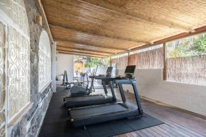 a fitness room with treadmills and a gym at Miramare Sea Resort & Spa in Ischia