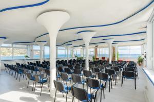 a room with rows of chairs and a blue ceiling at Miramare Sea Resort & Spa in Ischia +37 photos