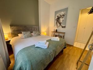 Postel nebo postele na pokoji v ubytování Les Lys d'Or