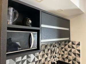 Kuchyň nebo kuchyňský kout v ubytování Suíte Premium de Alto Padrão I - Climatizado