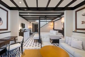 a living room with a couch and a table at Ocean Riviera Paradise All Inclusive in Playa del Carmen
