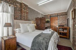 Ліжко або ліжка в номері Pause Studio Room Yzerfontein