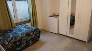 Ένα ή περισσότερα κρεβάτια σε δωμάτιο στο Chambre 2lit célibataire schaarbeek sous-sol