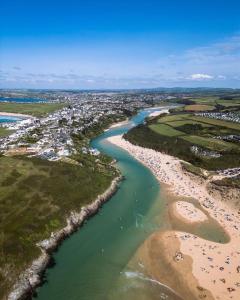 an aerial view of a beach and a river at LakeView Lodge Trevella Park in Crantock +4 photos