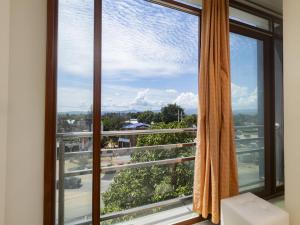 a window with a view of a city at Hotel San Marino Tarapoto in Tarapoto