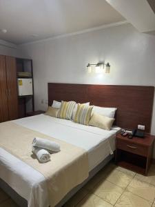Postel nebo postele na pokoji v ubytování Hostal Bicentenario
