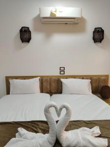 Postel nebo postele na pokoji v ubytování JJ Guesthouse