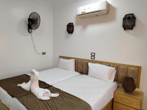 Postel nebo postele na pokoji v ubytování JJ Guesthouse