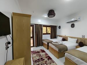 Postel nebo postele na pokoji v ubytování JJ Guesthouse