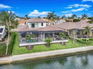 an aerial view of a house on the water at Exquisite waterfront Home featuring a pool and hot tub in Marco Island