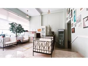 a living room with couches and posters on the wall at Vila Roma in Deva