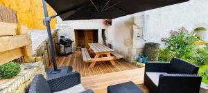 Posedenie v ubytovaní Gîte et SPA Chez Jules