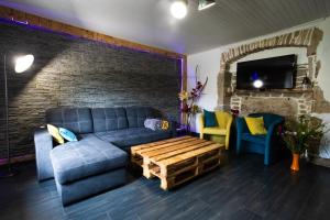 Posedenie v ubytovaní Gîte et SPA Chez Jules