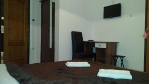 Un televizor și/sau centru de divertisment la Guesthouse Rupčič