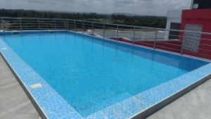 a large swimming pool on top of a building at Kanaprime Hotels & Safaris Mtwapa Gem in Mtwapa