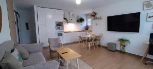 a living room with a couch and a table at La Casita de Eli in Becerril de la Sierra