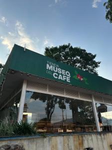 a building with a sign for a museo del cafe at El Patriarca Hotel in Sasaima +32 photos