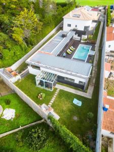 an aerial view of a house with a swimming pool at Villa Lapax by Ericeira Property in Ericeira