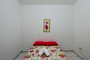 En eller flere senge i et værelse på Casa Aroma do Mar