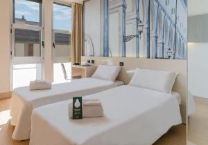Postel nebo postele na pokoji v ubytování B&B Hotel Firenze City Center
