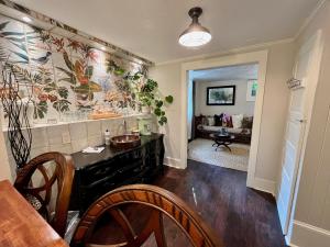 a kitchen with a counter and a dining room at Dougan Suites in Portland +17 photos