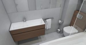 a bathroom with a sink and a toilet and a mirror at Hotel Santa Maria in Saint-Florent