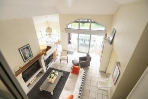 an overhead view of a living room with a couch at Villa 145 m near ocean with pool and garden in Moliets-et-Maa
