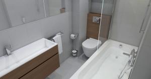 a bathroom with a tub and a toilet and a sink at Hotel Santa Maria in Saint-Florent