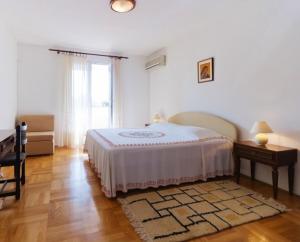 Postel nebo postele na pokoji v ubytování Apartment Parenzana