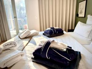 Ein Bett oder Betten in einem Zimmer der Unterkunft FIRST im FIRST Sellin, Penthouse Meer & Meer mit phänomenalem Ostseeblick