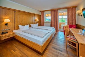 Postel nebo postele na pokoji v ubytování Hotel Happinger Hof