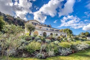 A garden outside Vigna Caio Relais & Spa