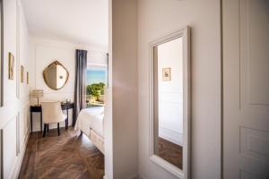 A bed or beds in a room at Vigna Caio Relais & Spa