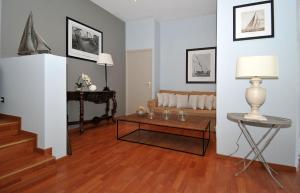 a living room with a couch and a table at Hotel Santa Maria in Saint-Florent