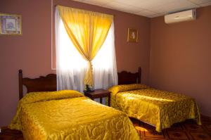 En eller flere senger på et rom på Hotel Antigua Comayagua
