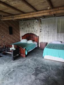 Ένα ή περισσότερα κρεβάτια σε δωμάτιο στο Casa en la montaña marinca