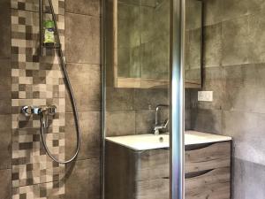 a bathroom with a shower and a sink at Gîte cosy avec WIFI et parking, proche nature - FR-1-589-781 in Le Clerjus +16 photos